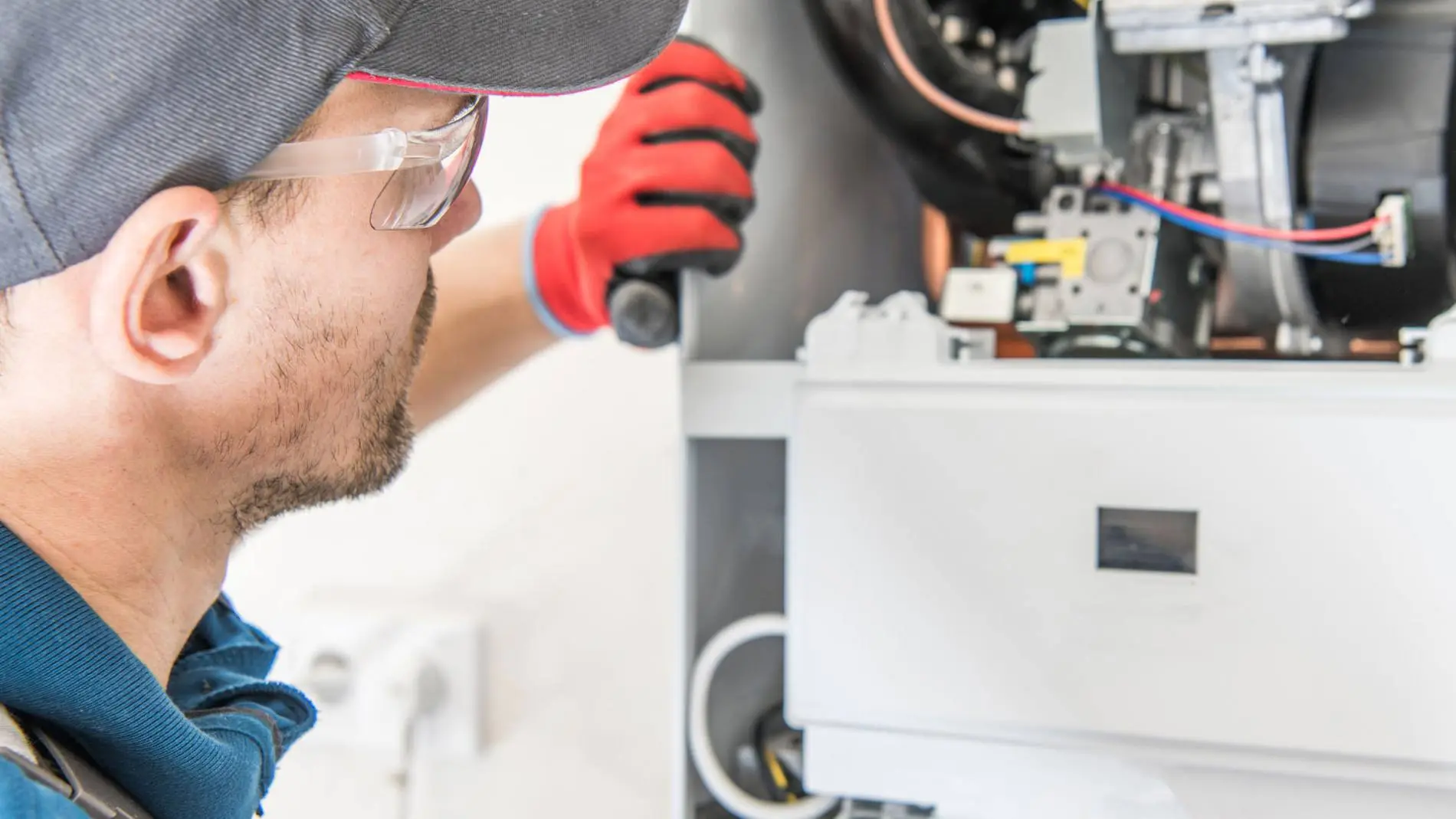 Gas engineer repairing a boiler for Bolton Domestic Gas Services Wolverhampton